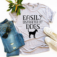 Thumbnail for Easily Distracted By Dogs T-shirtProduct description:
Make a statement with this Easily Distracted By Dogs T-shirt! It's made of premium quality ring spun cotton for a soft feel and comfortable fit.T-shirtsEXPRESS WOMEN'S FASHIONAgateEasily Distracted